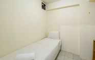 Bedroom 2 Comfort and Homey 2BR Green Pramuka City Apartment By Travelio