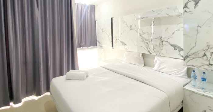 Bedroom Nice and Minimalist Studio at Vasanta Innopark Apartment By Travelio