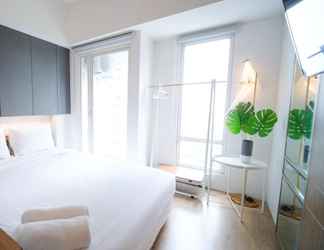 Bedroom 2 Homey and Enjoy Studio at Orchard Supermall Mansion Apartment By Travelio