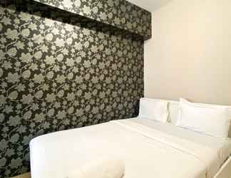 Bedroom 2 Homey and Warm Living 2BR at Springlake Summarecon Bekasi Apartment By Travelio