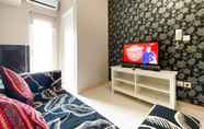 Common Space 4 Homey and Warm Living 2BR at Springlake Summarecon Bekasi Apartment By Travelio