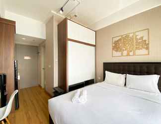 Bedroom 2 Cozy and Warm Studio at Vasanta Innopark Apartment By Travelio