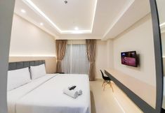 Bedroom 2 Comfortable and Modern Look Studio at Patraland Amarta Apartment By Travelio
