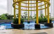 Swimming Pool 2 Cozy and Modern Design 2BR Bassura City Apartment near Mall By Travelio