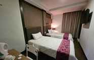 ห้องนอน 2 Warisan Hotel