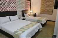 ห้องนอน Warisan Hotel
