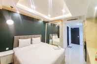 Bedroom Cozy and Great Deal Studio Patraland Amarta Apartment By Travelio