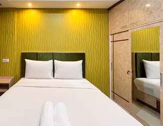 Bedroom 2 Modern Studio Room at Tamansari Skylounge Makassar Apartment By Travelio