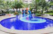Swimming Pool 6 Homey and Spacious 3BR Apartment at Sky House BSD By Travelio