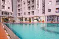 Kolam Renang Homey and Wonderful 1BR Apartment Royal Olive Residence By Travelio