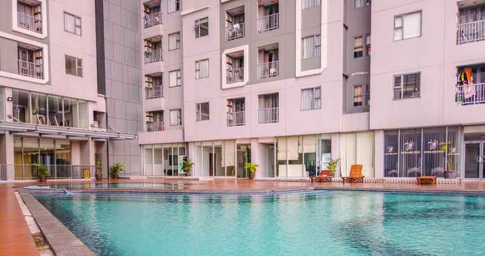 Swimming Pool Homey and Wonderful 1BR Apartment Royal Olive Residence By Travelio