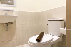 In-room Bathroom Serene Designed 2BR Apartment at Meikarta By Travelio