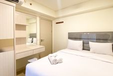 Bedroom Serene Designed 2BR Apartment at Meikarta By Travelio