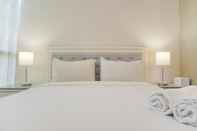 Kamar Tidur Warm and Nice 2BR Apartment Casa Grande Residence By Travelio