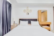 ห้องนอน Spacious and Comfort 2BR at Tamansari Bintaro Mansion Apartment By Travelio