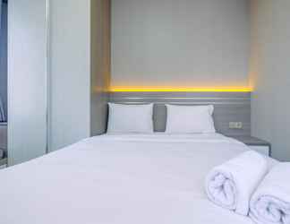 Bedroom 2 Homey and Restful 2BR at Transpark Cibubur Apartment By Travelio