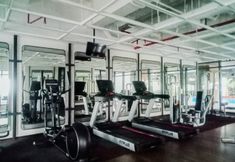 Fitness Center 6 Studio with Sofa at Carstensz Residence Apartment By Travelio