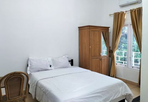 Kamar Tidur Wisma Silampari Mitra RedDoorz