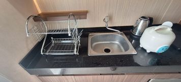 Ruang untuk Umum 2 Minimalism Designed 1BR at Parahyangan Residence Apartment By Travelio