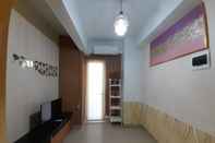 Lobi Warm and Homey 1BR at Student Castle Yogyakarta Apartment By Travelio