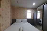 Kamar Tidur Warm and Homey 1BR at Student Castle Yogyakarta Apartment By Travelio