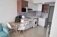 Lobi Cozy Living Studio Apartment at Tamansari Bintaro Mansion By Travelio