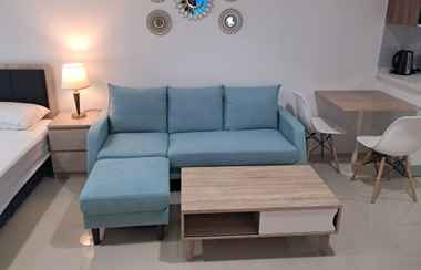 Common Space 2 Homey and Modern Look Studio Tamansari Bintaro Mansion Apartment By Travelio