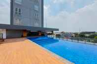 Swimming Pool Comfy and Restful 1BR Tamansari Bintaro Mansion Apartment By Travelio