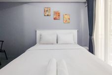 Bedroom Homey Grey Studio at Grand Asia Afrika Apartment Bandung By Travelio