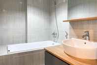In-room Bathroom Spacious and Homey Studio Vasanta Innopark Apartment By Travelio