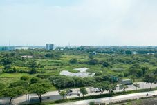 Bangunan Homey and Spacious 2BR with Extra Room at Meikarta Apartment By Travelio