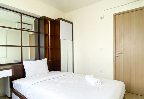Kamar Tidur Homey and Spacious 2BR with Extra Room at Meikarta Apartment By Travelio