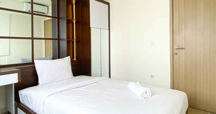 Bedroom Homey and Spacious 2BR with Extra Room at Meikarta Apartment By Travelio