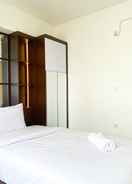 BEDROOM Homey and Spacious 2BR with Extra Room at Meikarta Apartment By Travelio