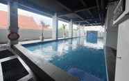 Swimming Pool 4 Homey No Kitchen Studio at Grand Darmo Suite Apartment By Travelio