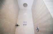 Toilet Kamar 2 Homey No Kitchen Studio at Grand Darmo Suite Apartment By Travelio