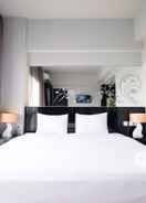 BEDROOM Homey No Kitchen Studio at Grand Darmo Suite Apartment By Travelio