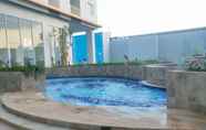 Swimming Pool 4 Cozy Living and Strategic Studio Apartment at Suncity Residence By Travelio
