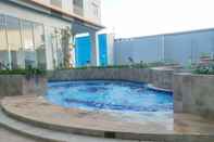 Swimming Pool Cozy Living and Strategic Studio Apartment at Suncity Residence By Travelio