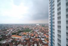 Exterior Cozy Living and Strategic Studio Apartment at Suncity Residence By Travelio