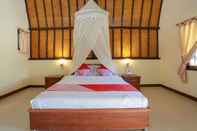 Bedroom SPOT ON 93378 Lona Guest House Syariah
