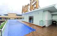 Swimming Pool 4 Minimalist Studio at Apartment Altuz Seturan Yogyakarta By Travelio