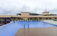 Swimming Pool 6 Cozy Stay Room Studio at Apartment Altuz Seturan Yogyakarta By Travelio