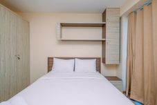 Phòng ngủ Warm and Comfortable 2BR at Tifolia Apartment By Travelio