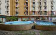 Swimming Pool 6 Spacious 3BR at Apartment Green Palm Residence By Travelio