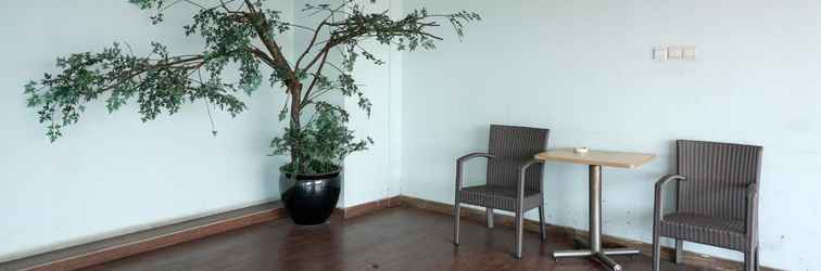 Lobby Warm and Nice Studio at Belmont Residence Puri Apartment By Travelio