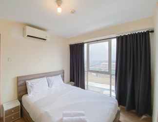 Bedroom 2 Enjoy Living and Cozy 2BR Tifolia Apartment By Travelio