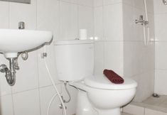 In-room Bathroom 4 Living Comfort 3BR at Springlake Summarecon Bekasi Apartment By Travelio