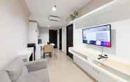 Lobby 6 Cozy and Minimalist 1BR at Patraland Amarta Apartment By Travelio