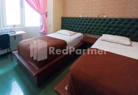 Bedroom Nillo Hotel Kebumen Mitra RedDoorz